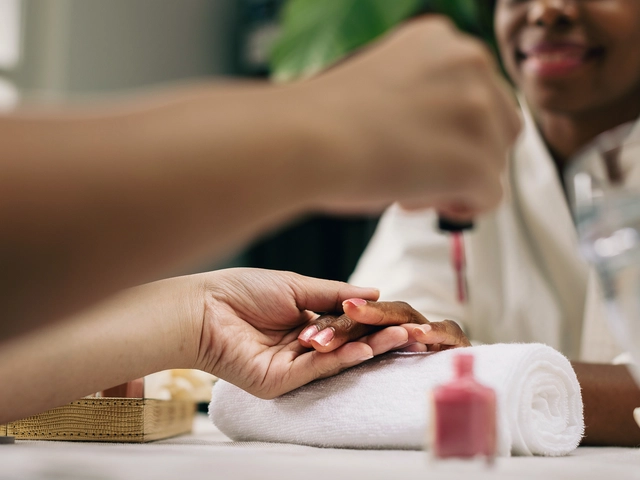 A nail technician prepares to apply polish to a client's nails